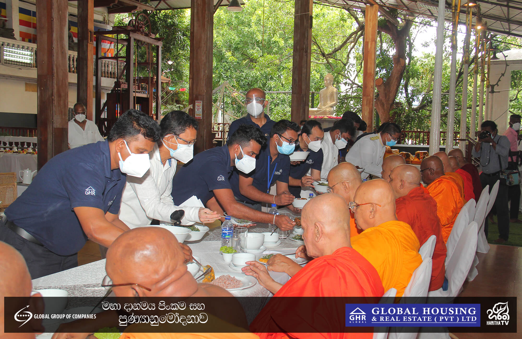 An image of people serving monks